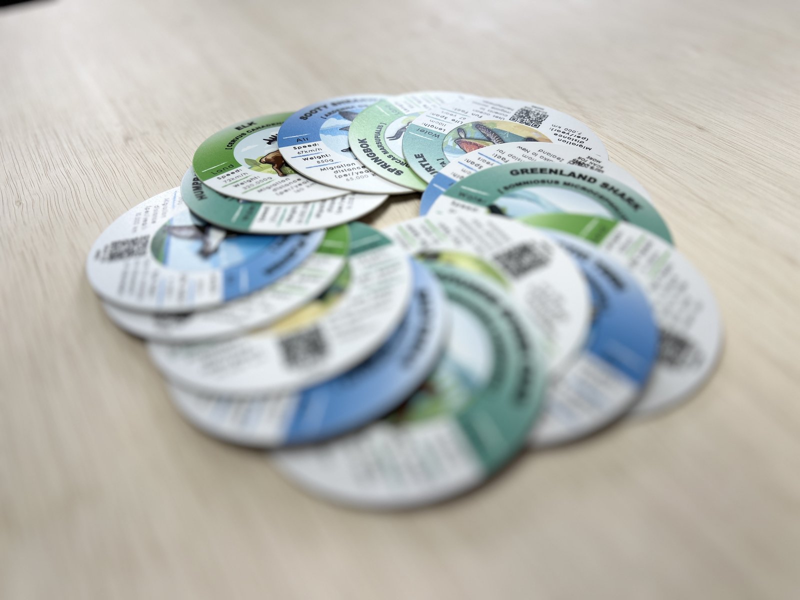Round Navigators of Nature cards displayed in a fan.